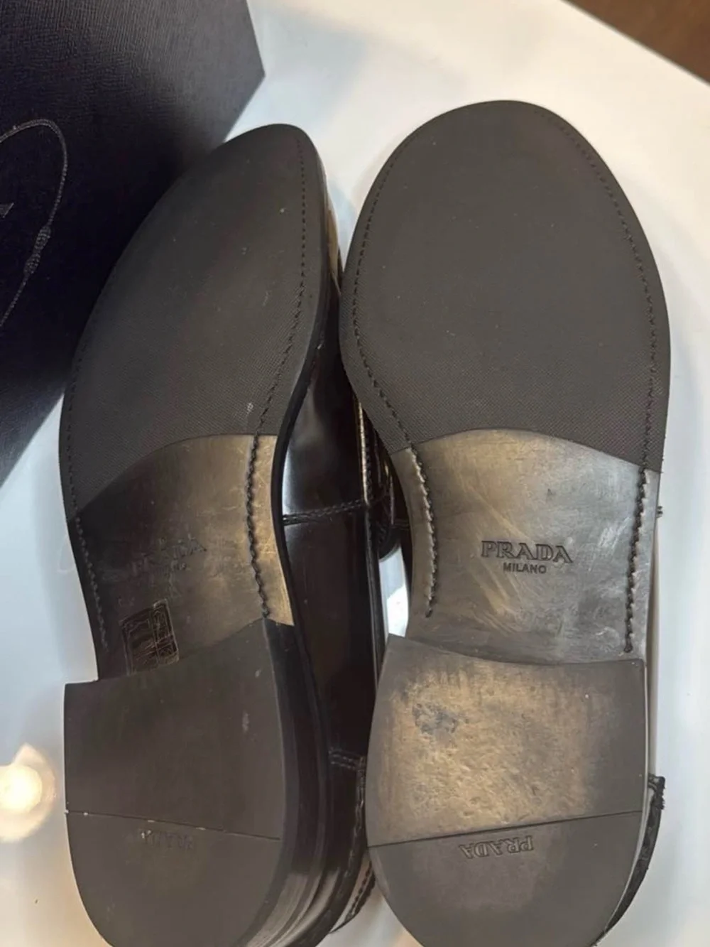 Prada Black Leather Men's Slip-On Loafers with Gold Logo